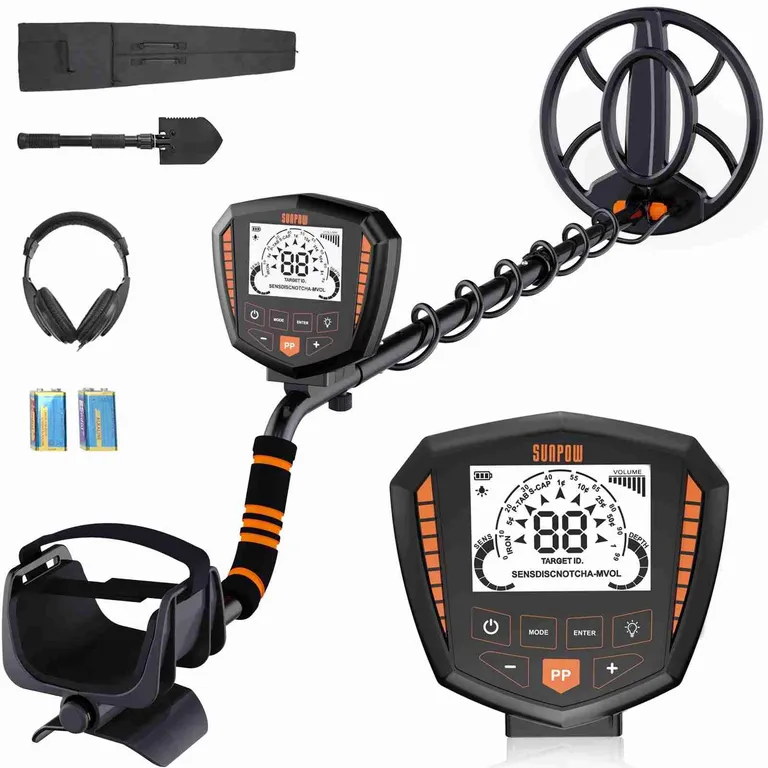An earlier SUNPOW metal detector kit with a large backlit control box, headphones and shovel